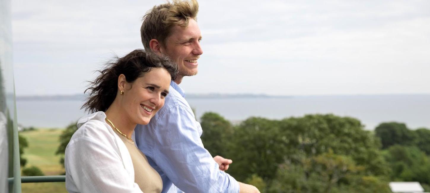 A couple looking out from the church and lighthouse at Tunø Church in Destination Coastal Land