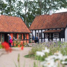 People are walking by the open air museum in Glud